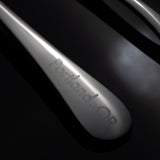 close up, engraved Portland, OR on cupping spoon handle